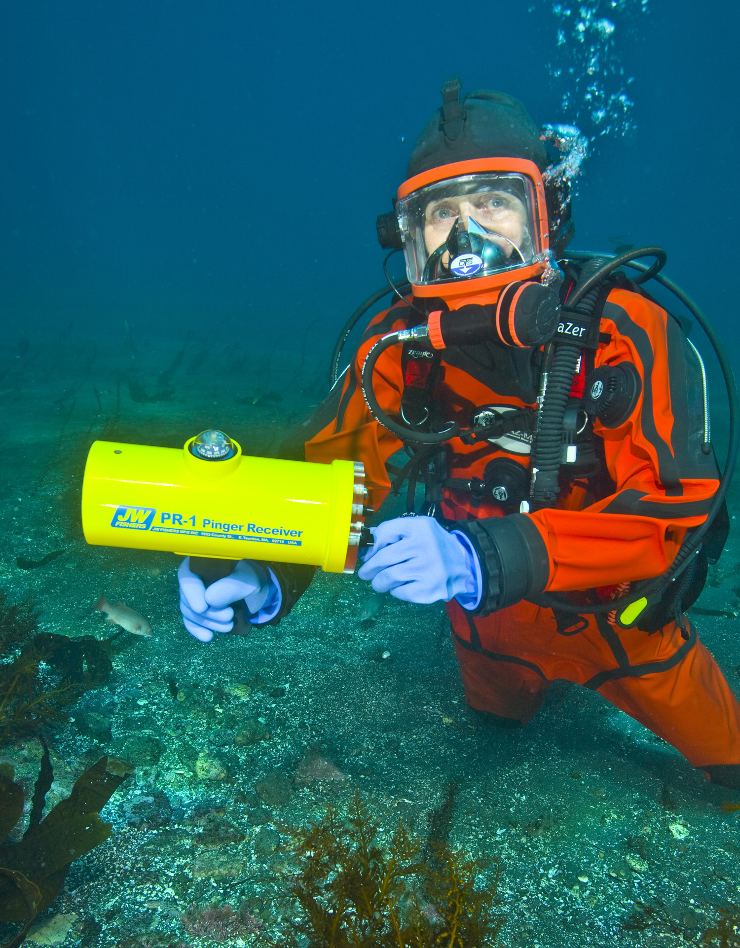 A diver holding a PR-1 under water