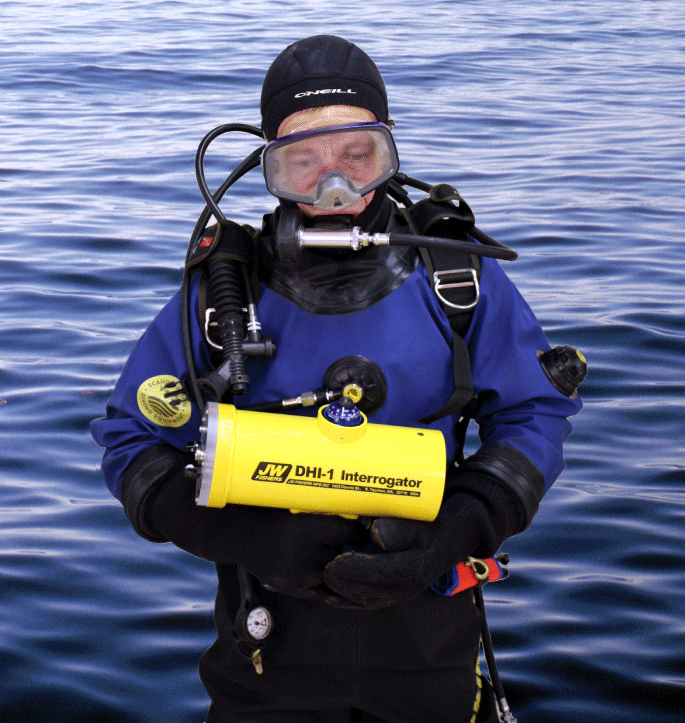 A diver carrying a Diver Held Interrogator (DHI)