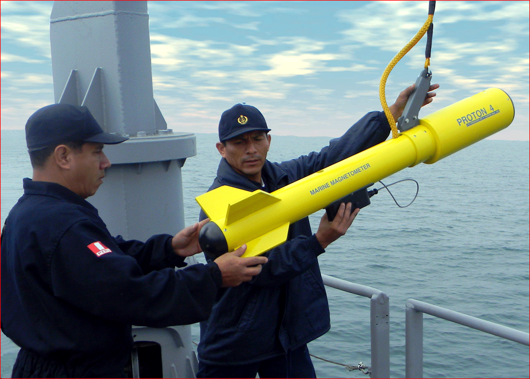 Officers from Peruvian Navy launch one their Proton 4 magnetometers